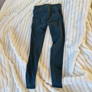lululemon athletica dark teal leggings with laser cut design in legs